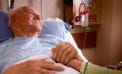 Old man lying in hospital bed holding daugher Canada’s hospital system ill-prepared for COVID-19 crisis