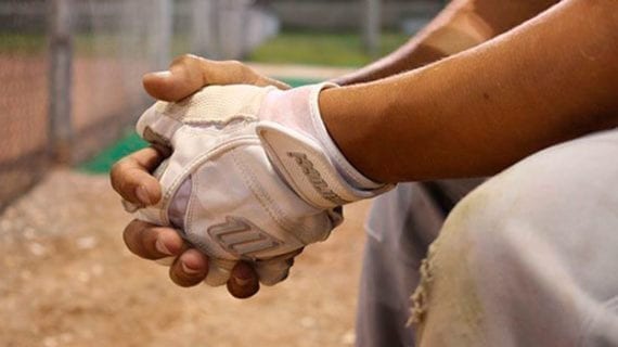 Baseball player sittnig on the bench Baseball’s big free-agent balk
