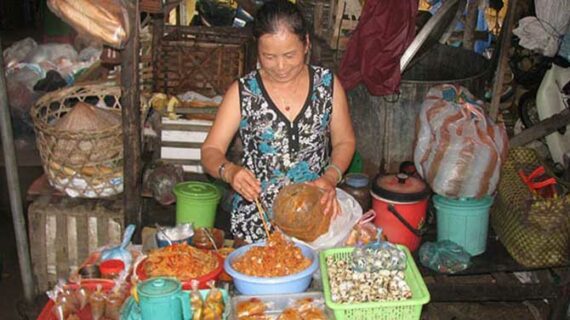An open air market in Vietnam Dampening Asian demand cools crude oil prices