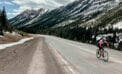 Lisa Monforton, ConnecTour group member, rides the road the Highwood Pass, at 2,206 metres, the highest elevation paved pass in Canada COVID panic? Keep calm and carry on with bike tour planning
