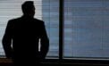 Businessman staring out of window Why many leaders are lonely and what to do about it