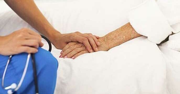 Doctor holding patient Canada can’t afford its current approach to health care